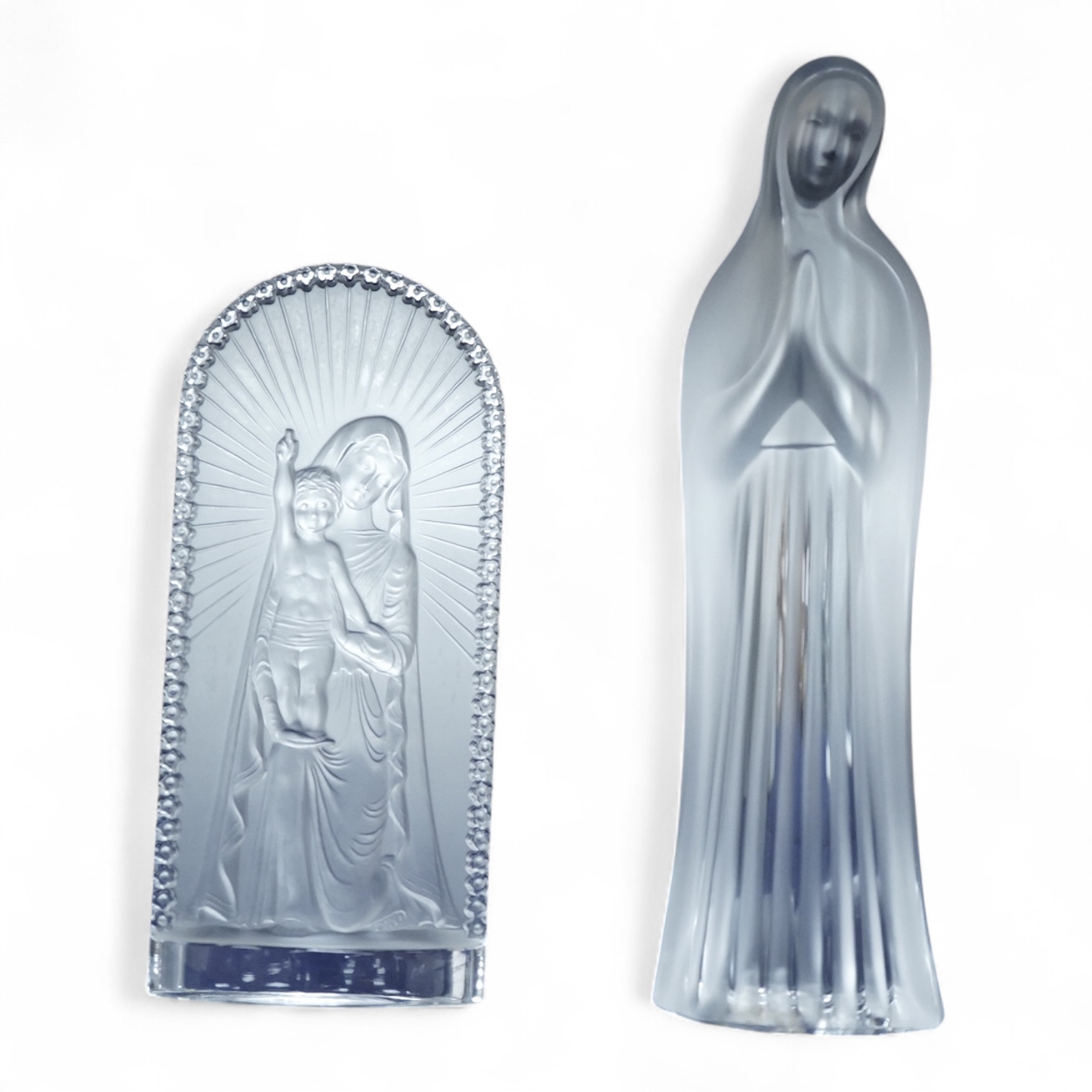 A Lalique ‘Vierge A L’Enfant Agenouille statue’ 20cm high, together with a model of ‘Virgin with hands together’, 25cm high (both boxed)